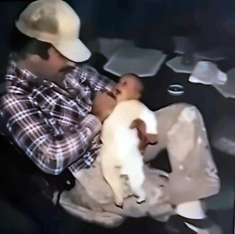 Jimmy Venturini holding his son Michael as a baby